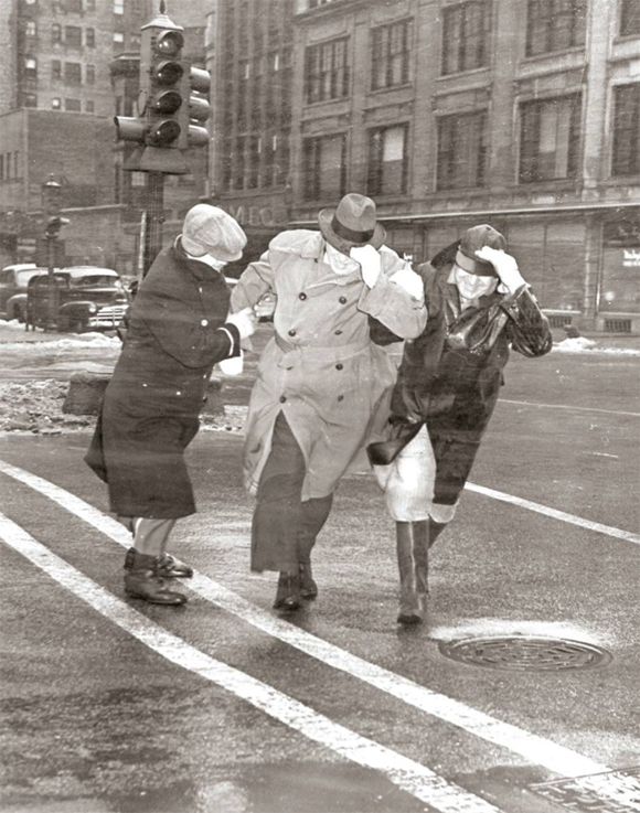 Two ladies crossing Chicago street with gentleman